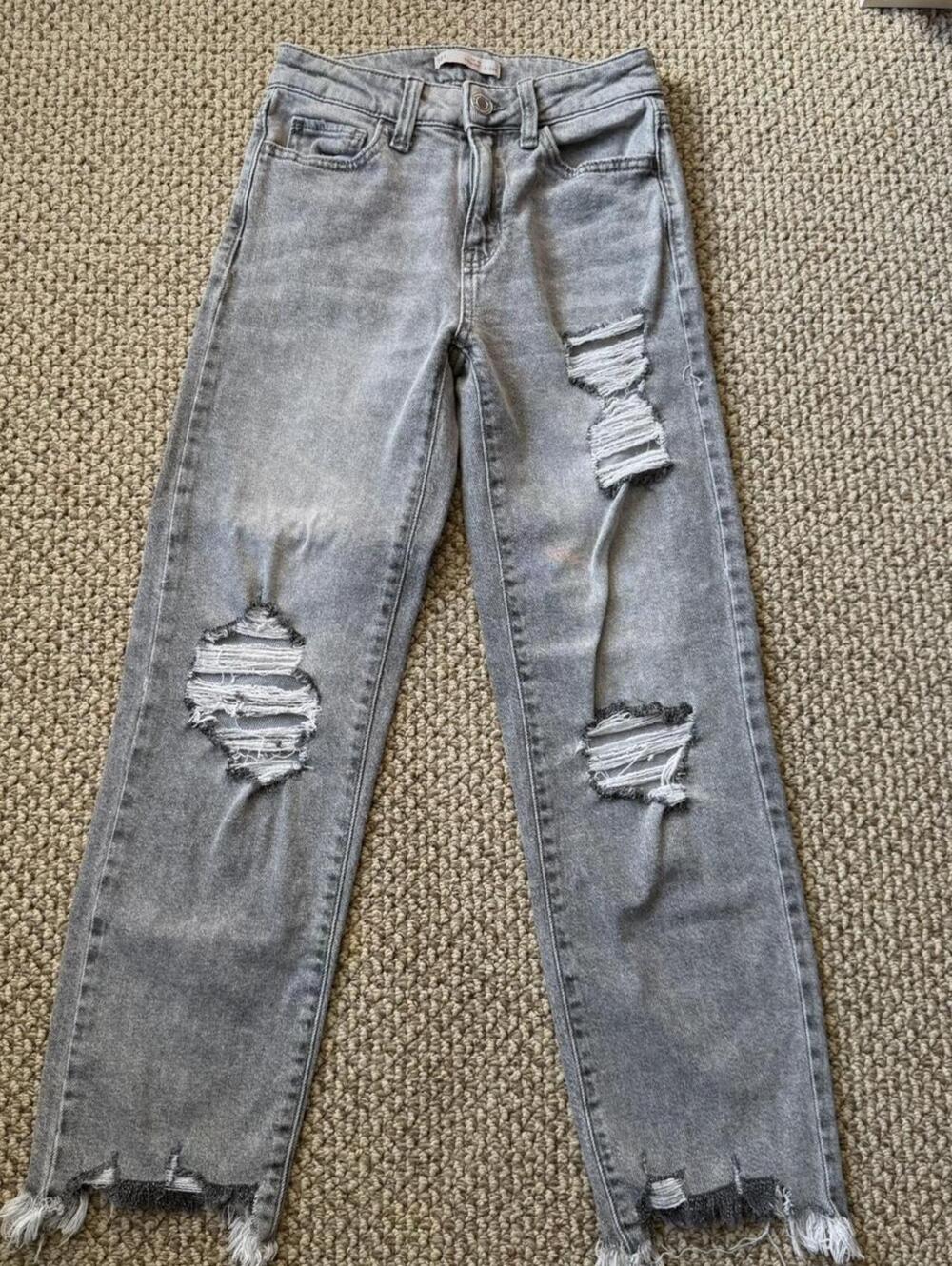 Ripped grey jeans with a vintage vibe